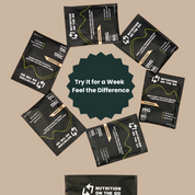 Black protein powder packets with promotional text on a beige background