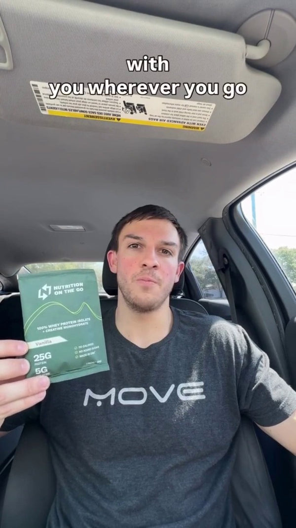 Chase M holding a Nutrition On The Go packet in his car