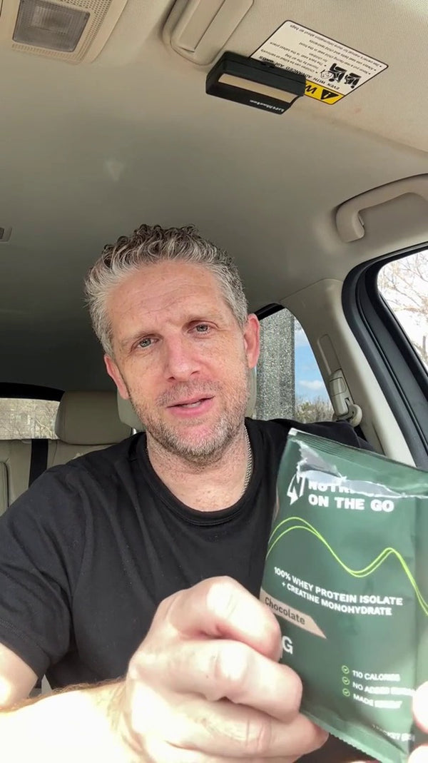 Scott M. holding a Nutrition On The Go packet in his car